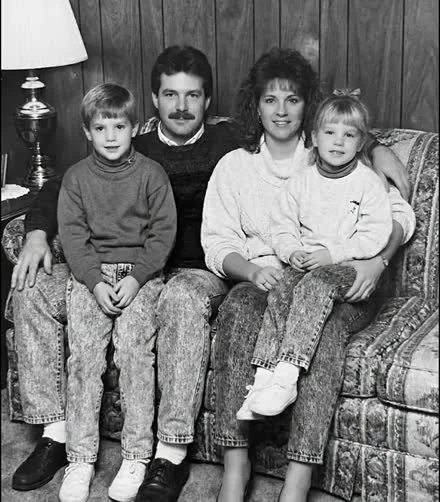 Faded black-and-white family photo before restoration